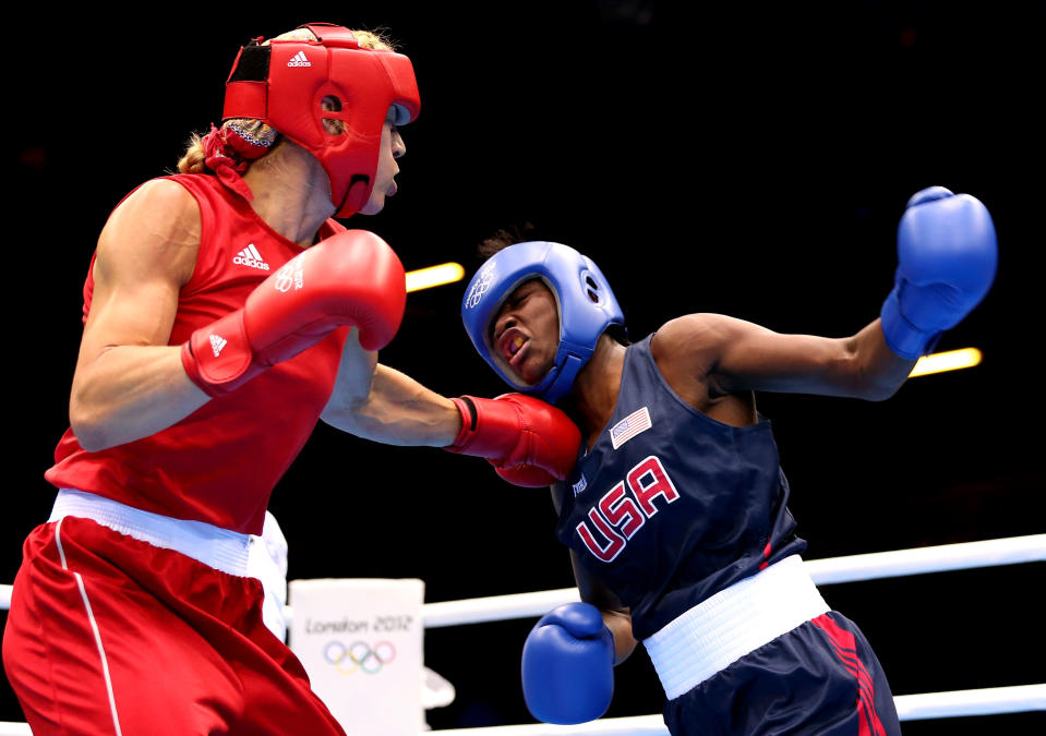 LONDON, ENGLAND - AUGUST 06: Claressa Shields (Blue) of the United States competes against Anna Laurell of Sweden (Red) during the Women's Middle (75kg) Boxing Quarterfinals on Day 10 of the London 2012 Olympic Games at ExCeL on August 6, 2012 in London, England. (Photo by Scott Heavey/Getty Images)