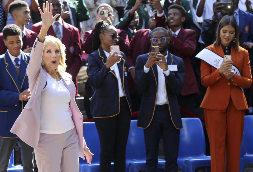 U.S. First lady Jill Biden, left, greets students while on a visit to the University of Science and Technology in Windhoek, Namibia, Friday, Feb. 24, 2023. Biden told the young people that the democracy their parents and grandparents fought for is now theirs to defend and protect. (AP Photo/Dirk Heinrich)