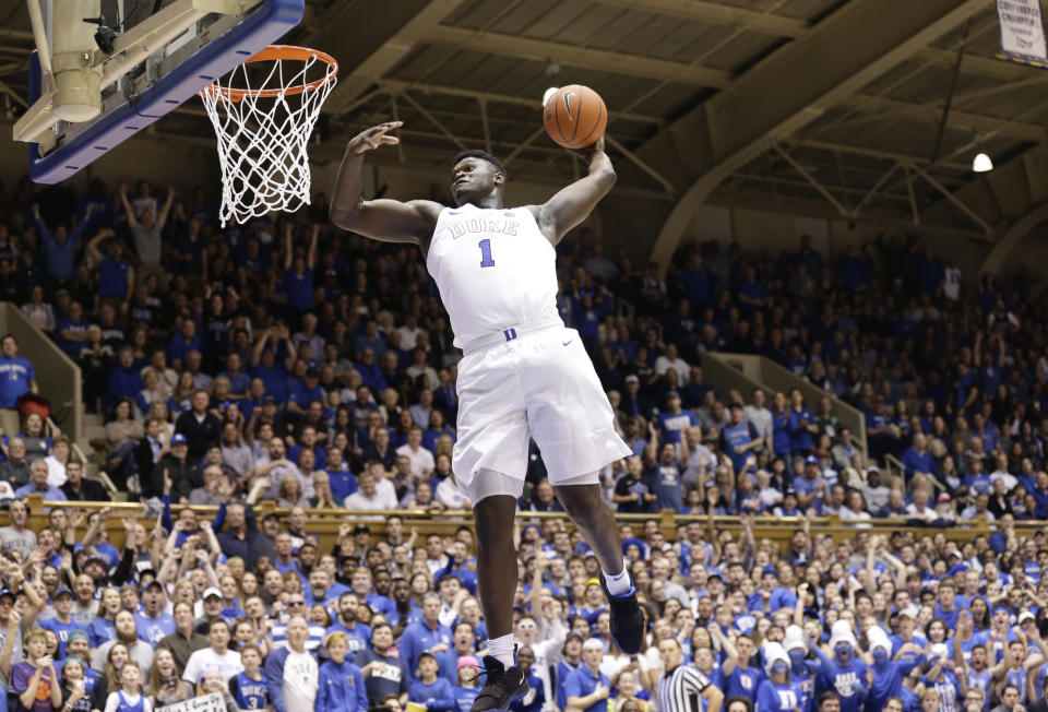 FILE - In this Jan. 5, 2019, file photo, Duke's Zion Williamson (1) drives for a dunk against Clemson during the second half of an NCAA college basketball game, in Durham, N.C. Zion Williamson is the most hyped, most exciting prospect to come to the NBA in years. He's set to be the No. 1 pick in the draft, perhaps the only certainty heading into Thursday night, June 20. (AP Photo/Gerry Broome, File)