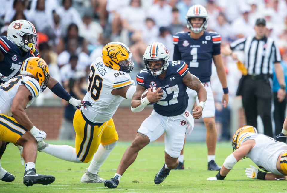 Auburn Tigers running back Jarquez Hunter (27) runs the ball as Auburn Tigers take on California Golden Bears at Jordan-Hare Stadium in Auburn, Ala., on Saturday, Sept. 7, 2024. California Golden Bears leads Auburn Tigers 14-7 at halftime.