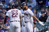 Cleveland Indians' Bobby Bradley, right, celebrates with Josh Naylor after they scored on Naylor's two-run home run off Chicago Cubs starting pitcher Albert Alzolay during the fifth inning of a baseball game Monday, June 21, 2021, in Chicago. (AP Photo/Charles Rex Arbogast)