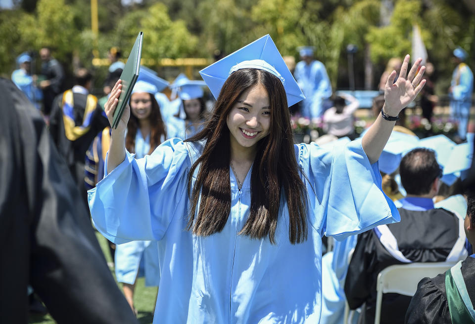 IRVINE, CA - JUNE 07: Graduate Caroline Hong is all smiles after receiving her diploma during the commencement ceremony at Irvine High School in Irvine, CA, on Thursday, June 7, 2018. (Photo by Jeff Gritchen/Digital First Media/Orange County Register via Getty Images)