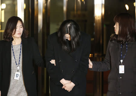 Cho Hyun-ah (C), also known as Heather Cho, daughter of chairman of Korean Air Lines, Cho Yang-ho, leaves for a detention facility after a Korean court ordered her to be detained, at the Seoul Western District Prosecutor’s office December 30, 2014. REUTERS/Kim Hong-Ji