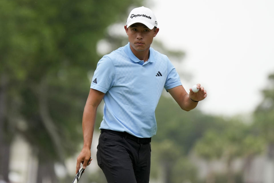 Collin Morikawa waves after making a putt on the first hole during the final round of the RBC Heritage golf tournament, Sunday, April 21, 2024, in Hilton Head Island, S.C. (AP Photo/Chris Carlson)