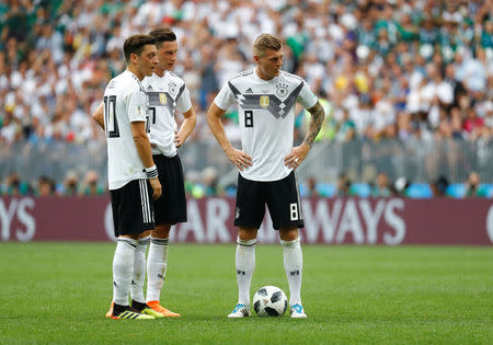 Soccer Football - World Cup - Group F - Germany vs Mexico - Luzhniki Stadium, Moscow, Russia - June 17, 2018 Germany's Mesut Ozil, Julian Draxler and Toni Kroos look dejected after Mexico's Hirving Lozano (not pictured) scored their first goal REUTERS/Kai Pfaffenbach