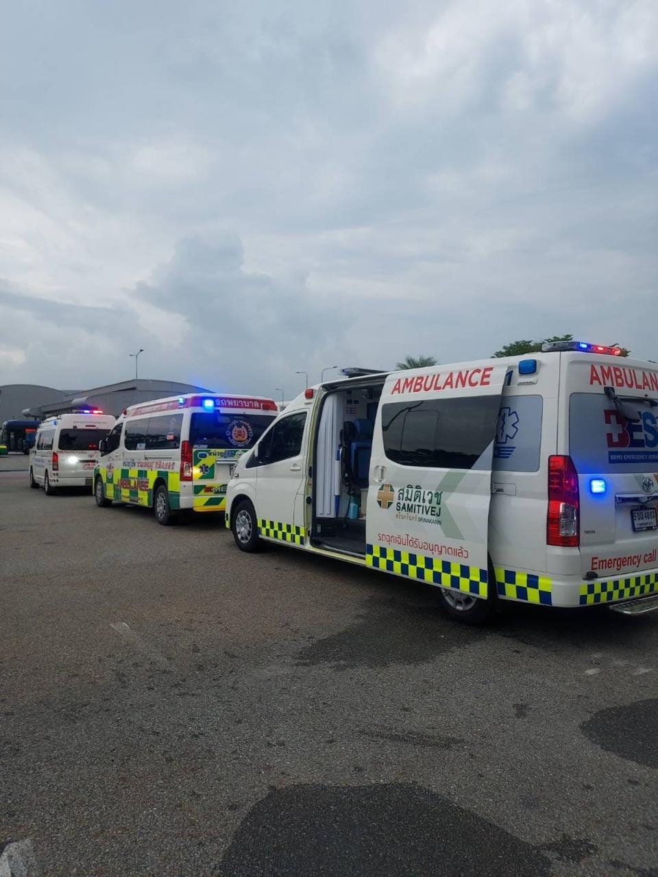 Ambulances at Bangkok airport treating injured passengers (X)