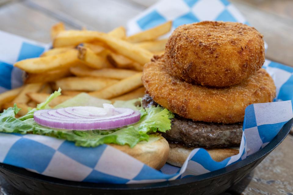 The Southerner at the Fifth Avenue Streatery features a 100 percent Florida-raised beef patty topped with fried green tomato, piquillo pimento cheese, lettuce, onion and house-made Remi sauce.