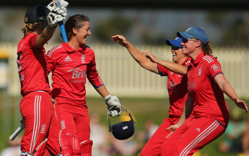 Sarah Taylor and Charlotte Edwards celebrate with their team-mates after winning the match and retaining the Ashes - GETTY IMAGES