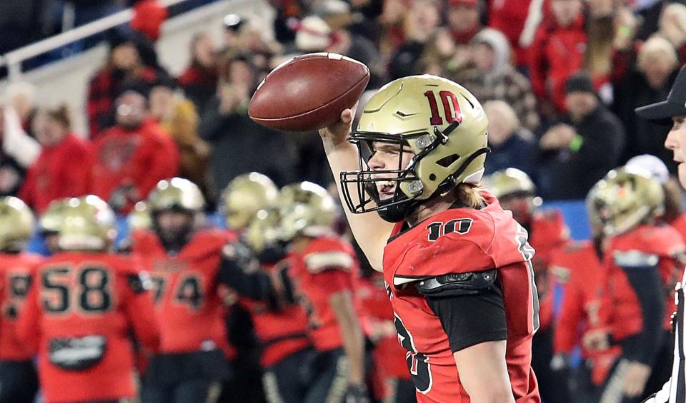 Bullitt East’s Travis Egan celebrates scoring a two-point conversion against Male.Dec. 3, 2022