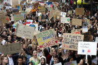 Youths take part to a climate march Friday, May 24, 2019 in front of the Opera house in Paris. Organizers expect more than one million young people to join protests over the world. (AP Photo/Michel Euler)