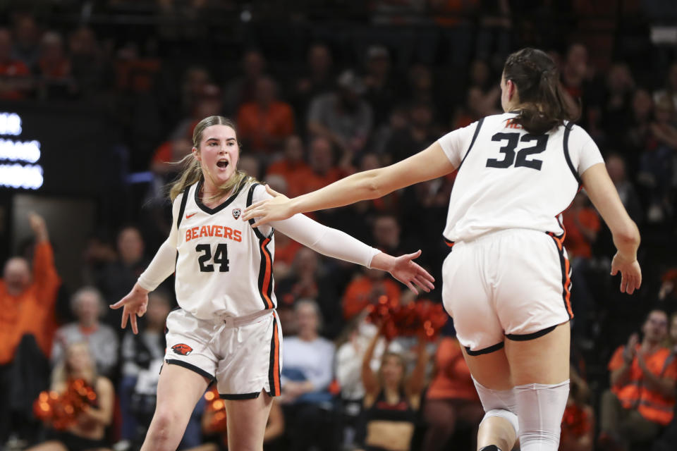 Oregon State guard Adlee Blacklock (24) slaps hands with center Sela Heide (32) after making a 3-point basket against Stanford during the first half of an NCAA college basketball game Thursday, Feb. 29, 2024, in Corvallis, Ore. (AP Photo/Amanda Loman)