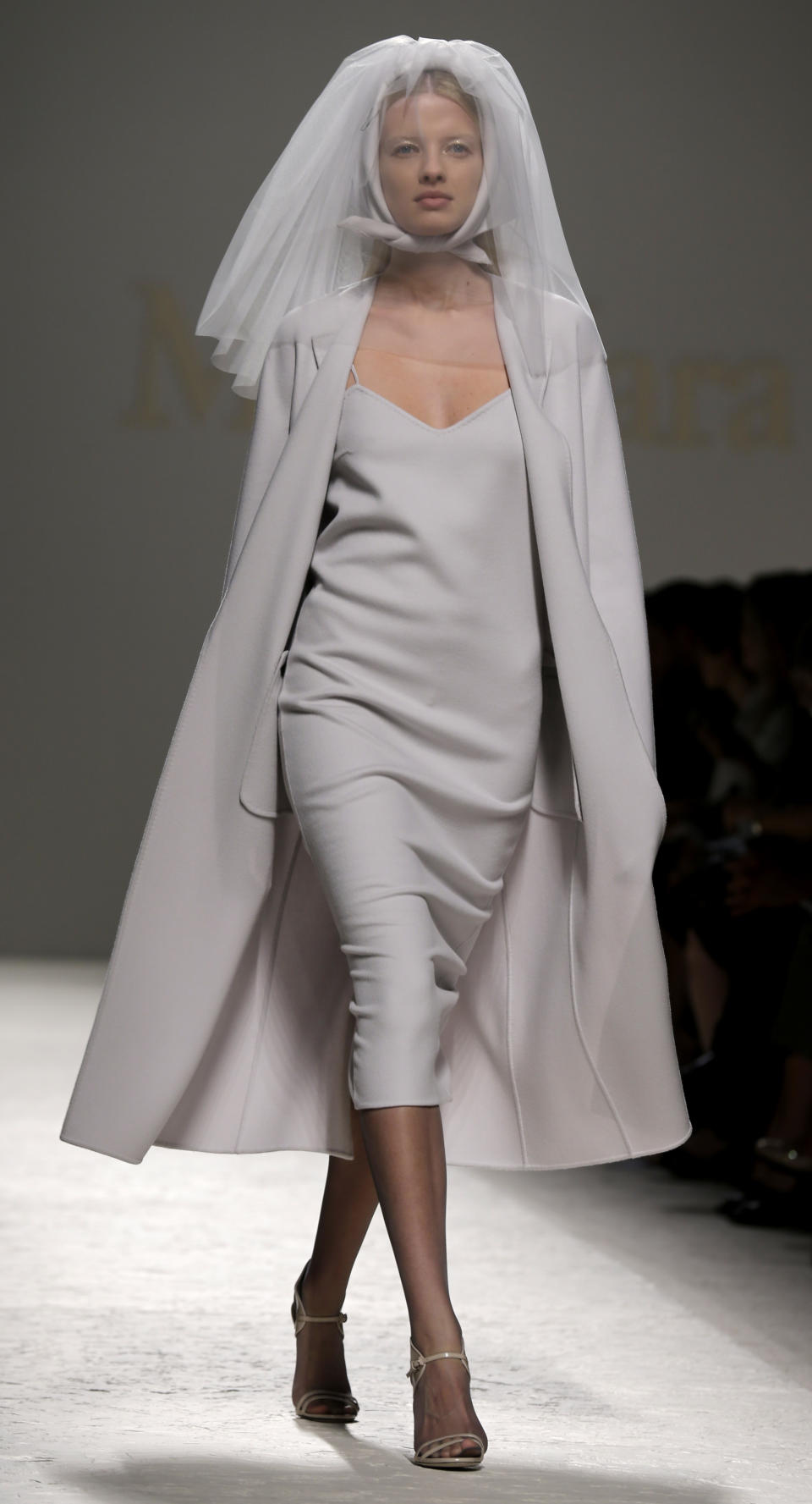 A model wears a creation for Max Mara women's Spring-Summer 2014 collection, part of the Milan Fashion Week, unveiled in Milan, Italy, Thursday, Sept. 19, 2013. (AP Photo/Luca Bruno)