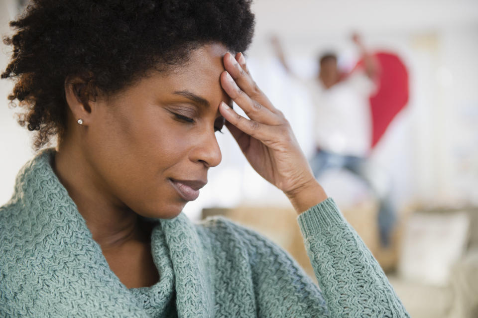 woman stressed with her hand on her head