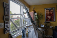 The inside of a home across the street is damaged after an explosion in Baltimore on Monday, Aug. 10, 2020. Baltimore firefighters say an explosion has leveled several homes in the city. (AP Photo/Julio Cortez)