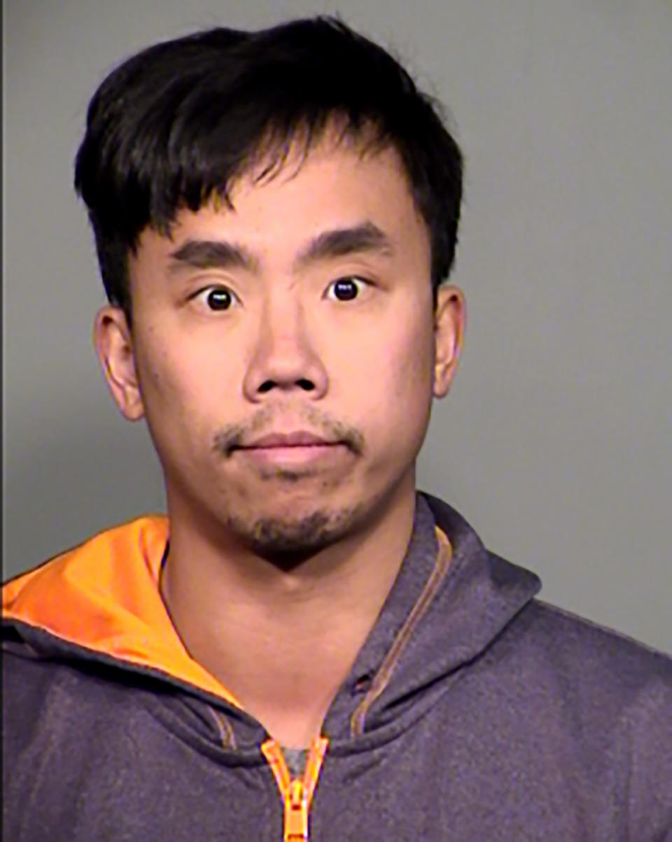 This undated booking photo provided by the Tempe Police Department shows Raymond Tang. Tang, described as a disgruntled former Waymo driver has been arrested on suspicion of deliberately crashing a passenger car into one of the company's vans with self-driving capabilities near Phoenix last month, authorities said Thursday, Feb. 13, 2020.(Tempe Police Department via AP)