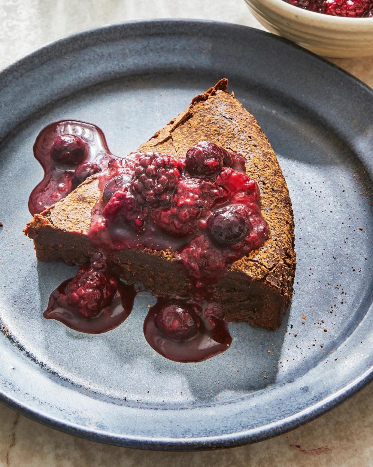 PHOTO: A flourless chocolate cake with compote from Suzy Karadsheh's new cookbook, 'The Mediterranean Dish: Simply Dinner.' (Caitlin Bensel/Clarkson Potter-Penguin Random House)