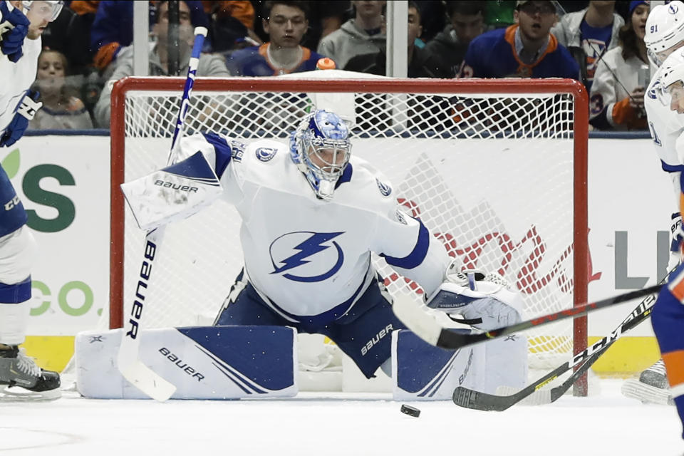 Tampa Bay Lightning goaltender Andrei Vasilevskiy stops a shot on goal during the first period of the team's NHL hockey game against the New York Islanders on Friday, Nov. 1, 2019, in Uniondale, N.Y. (AP Photo/Frank Franklin II)