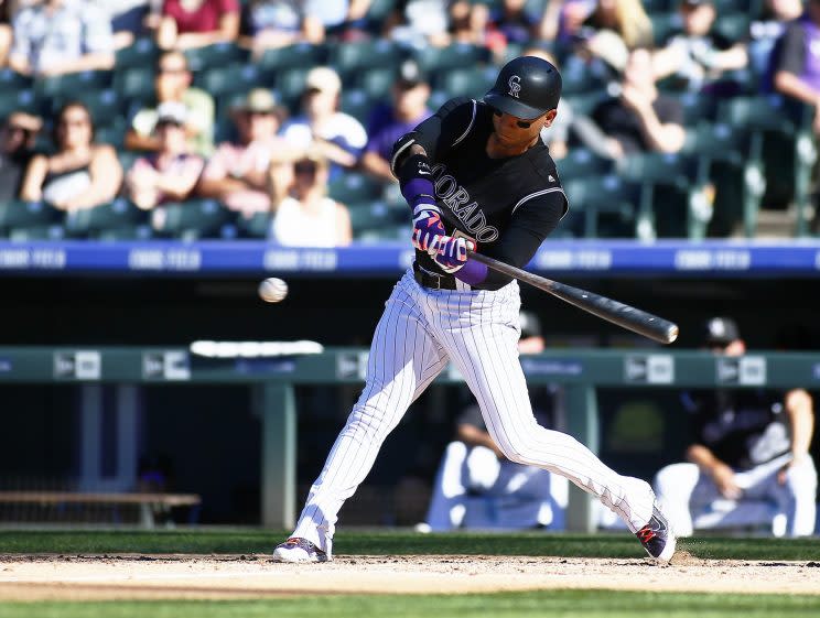 Maybe Carlos Gonzalez will stay in Colorado after all. (Getty Images/Russell Lansford)