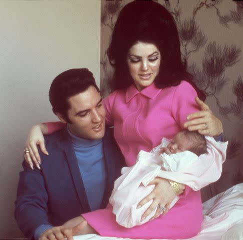 <p>Michael Ochs Archives/Getty</p> Elvis and Priscilla Presley with daughter Lisa Marie in February 1968