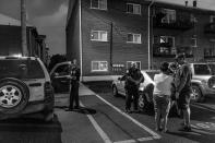 <p>In the parking lot outside Old Crow Bar, the Middletown Fire Department responds to a call about a possible heroin overdose. The woman insists that she’s fine — she doesn’t want to go to the hospital. (Photograph by Mary F. Calvert for Yahoo News) </p>