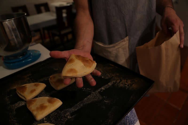 Pedro Campos bakes and sells homemade bread to his neighbours at Puente Alto area in the outskirt of Santiago