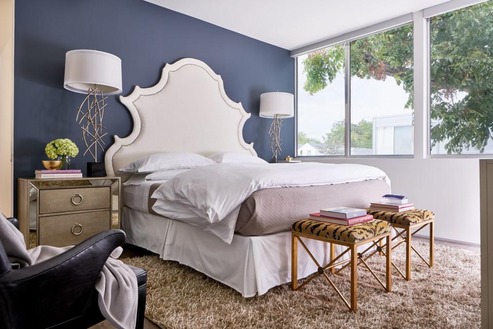 <p>Tiger-print stools and a winged headboard are standout features in a luxurious bedroom by <a href="https://deringhall.com/interior-designers/wesley-wayne-interiors" rel="nofollow noopener" target="_blank" data-ylk="slk:Wesley-Wayne Interiors;elm:context_link;itc:0;sec:content-canvas" class="link ">Wesley-Wayne Interiors</a>.</p>