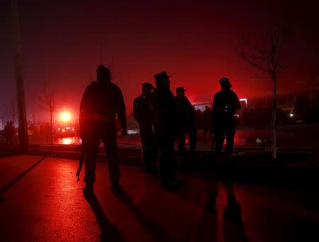 Afghan policeman keep watch near the site of a blast, in an area close to the Russian embassy in the west of the capital of Kabul, Afghanistan January 20, 2016. REUTERS/Ahmad Masood