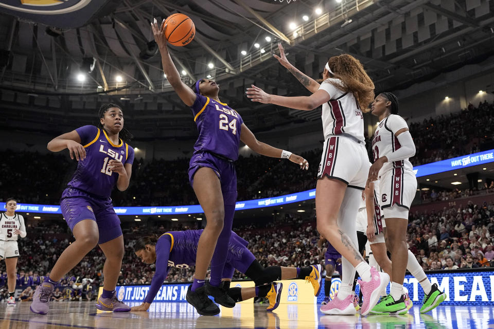 LSU guard Aneesah Morrow shoots over South Carolina center Kamilla Cardoso during the first half of an NCAA college basketball game at the Southeastern Conference women's tournament final Sunday, March 10, 2024, in Greenville, S.C. (AP Photo/Chris Carlson)