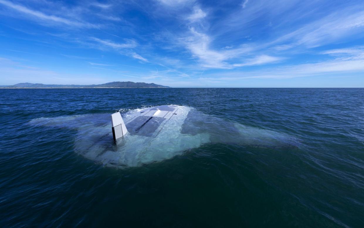 The Manta Ray on the surface in tests earlier this year. The 85-foot submarine 'glides' through the sea by varying its buoyancy to rise and fall