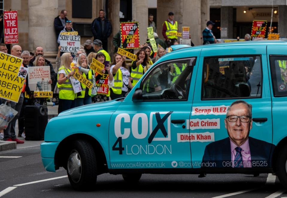 A taxi with an advert for Howard Cox (Chris J Ratcliffe/Getty Images)