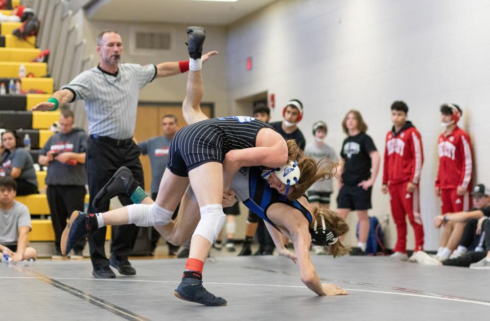 Washburn Rural's Henri McGivern competes against Junction City's Zac Petrusky during 6A Boys Regional Wrestling.