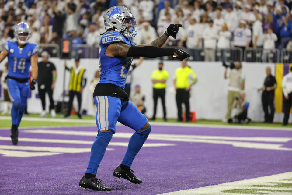Detroit Lions running back Jahmyr Gibbs (26) celebrates after scoring on a 3-yard touchdown run during the second half of an NFL football game against the Minnesota Vikings, Sunday, Dec. 24, 2023, in Minneapolis. (AP Photo/Bruce Kluckhohn)