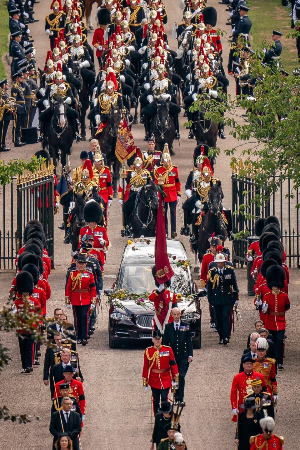 The Ceremonial Procession of the coffin of Queen Elizabeth passes through gates on the Long Walk as it arrives at Windsor Castle for the Committal Service at St George’s Chapel (Aaron Chown/PA) (PA Wire)