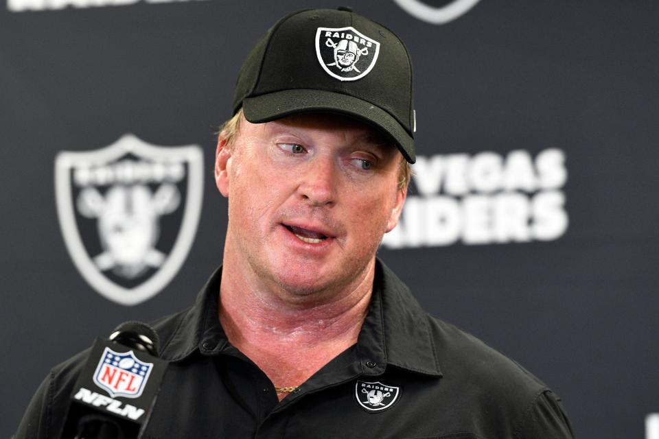 FILE - Las Vegas Raiders head coach Jon Gruden speaks with the media following an NFL football game against the Pittsburgh Steelers in Pittsburgh on Sept. 19, 2021. The former Raiders coach has sued commissioner Roger Goodell and the NFL, alleging that a "malicious and orchestrated campaign" was used to destroy his career by leaking old offensive emails from him. The suit was filed in district court in Clark County, Nev., on Thursday, Nov. 11, 2021, exactly a month after Gruden resigned as Raiders coach following the publication of his emails by the Wall Street Journal and New York Times. (AP Photo/Don Wright, File)