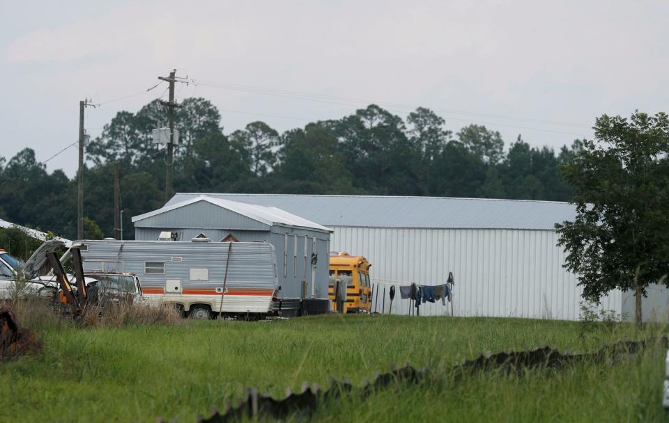 Clothes hung on a clothesline near a gray mobile home at the Cogdell Berry Farm in Clinch County, Georgia.