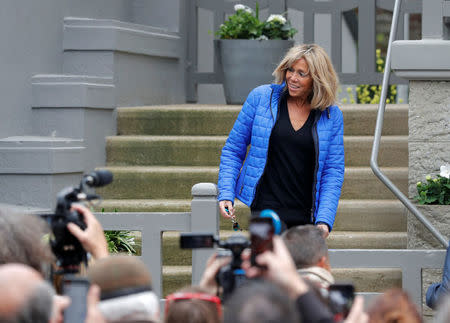 Brigitte Trogneux, wife of French presidential candidate Emmanuel Macron, speaks with media outside her house in Le Touquet, France, May 6, 2017. RTEUTERS/Philippe Wojazer