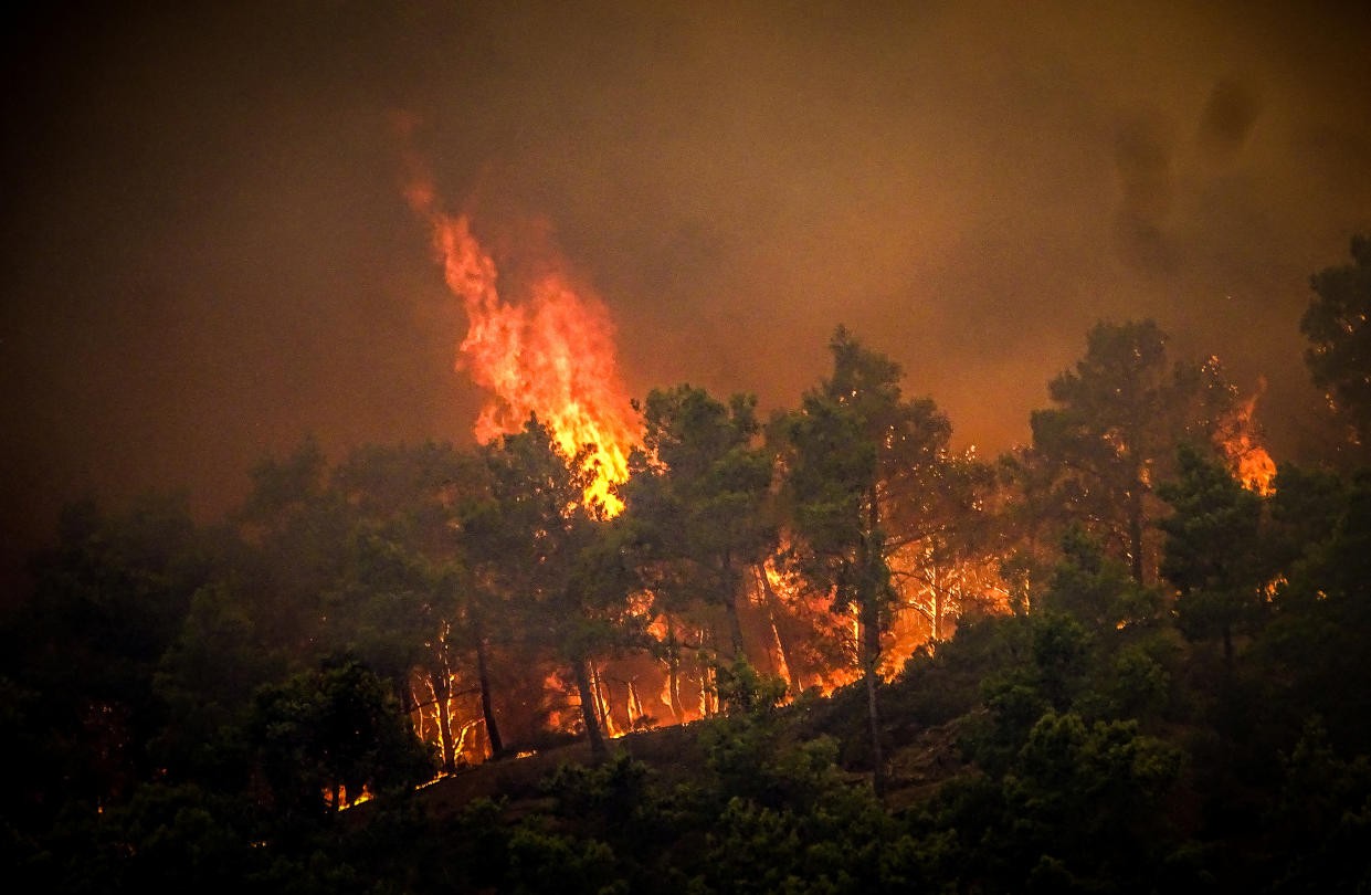 Smoke rises from a wildfire on the island of Rhodes, Greece