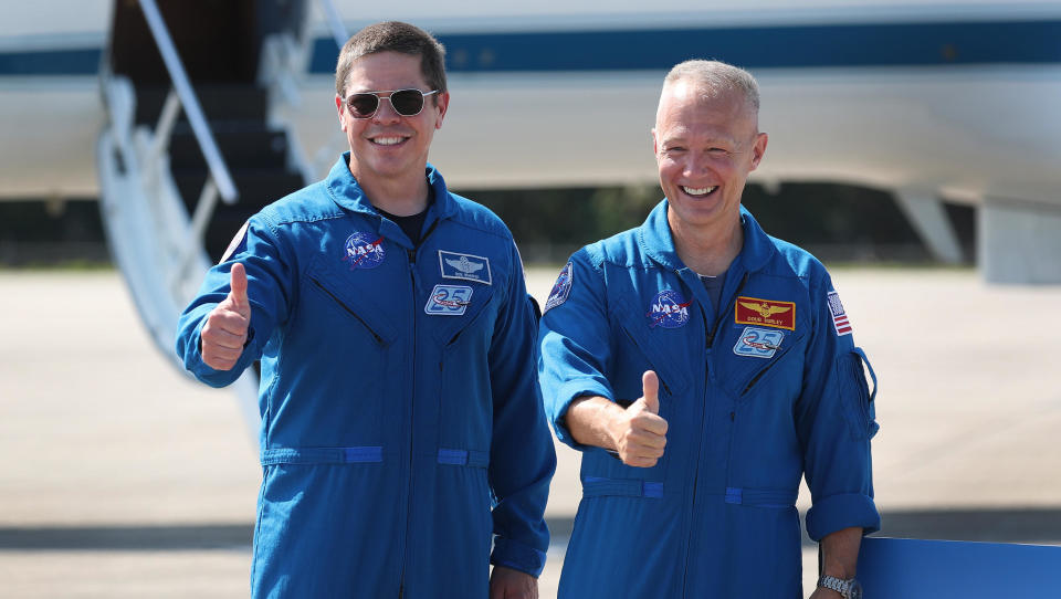 NASA astronauts Bob Behnken (left) and Doug Hurley (right) arrive at the Kennedy Space Center in Florida on May 20, 2020, ahead of their scheduled May 27th launch aboard a SpaceX Crew Dragon spacecraft. / Credit: Joe Raedle / Getty Images