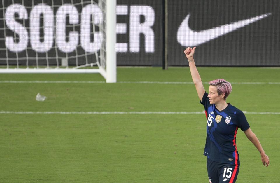 USA forward Megan Rapinoe acknowledges the crowd after scoring a first half goal against Brazil during their SheBelieves Cup international soccer tournament game at Exploria Stadium in Orlando, Florida on February 21, 2021. - Christen Press and Megan Rapinoe scored Sunday to lead the United States over Brazil 2-0 in the SheBelieves Cup, extending the reigning Women's World Cup champions' two-year unbeaten streak. (Photo by Gregg Newton / AFP) (Photo by GREGG NEWTON/AFP via Getty Images)