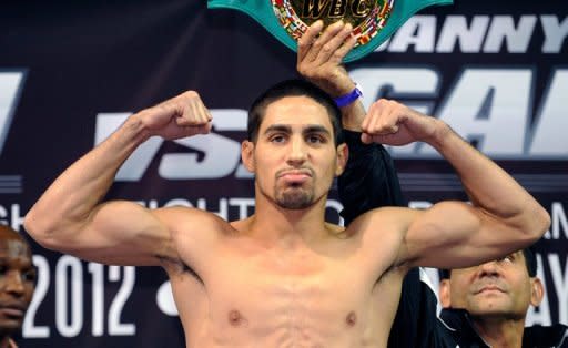 American Danny Garcia poses on the scales during the official weigh-in on July 13 in Las Vegas. For Garcia, Amir Khan would be the biggest victim on his unblemished record and could signal a jump into the welterweight division