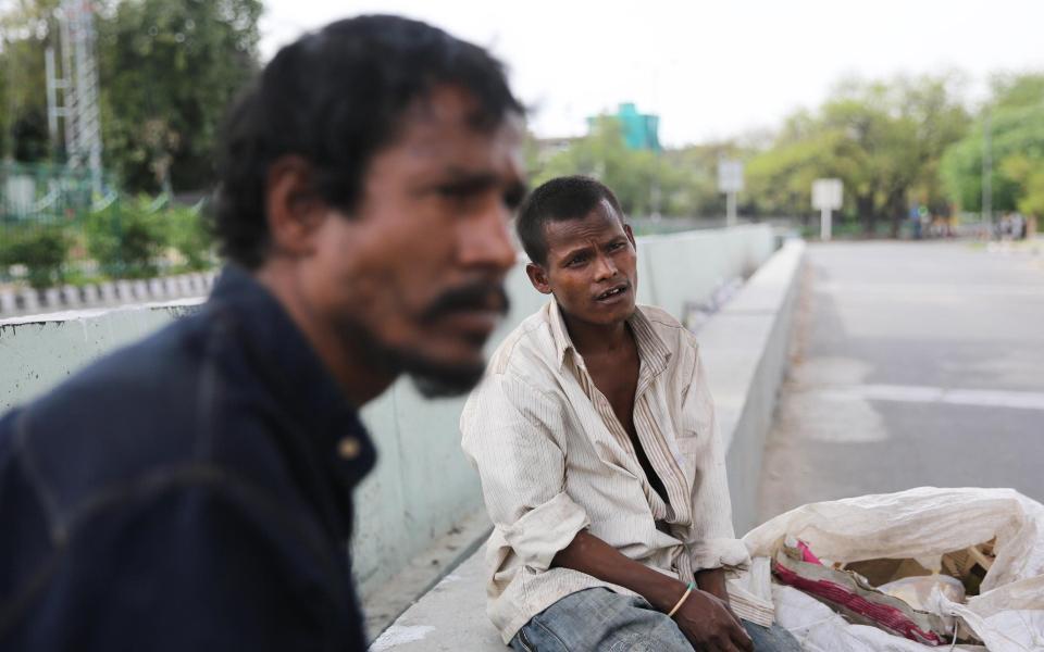 Sudhir Choudhury, 25 and Uttam Mani, 20 are rag pickers, searching through Delhi's rubbish for items to sell to recyclers - Cheena Kapoor