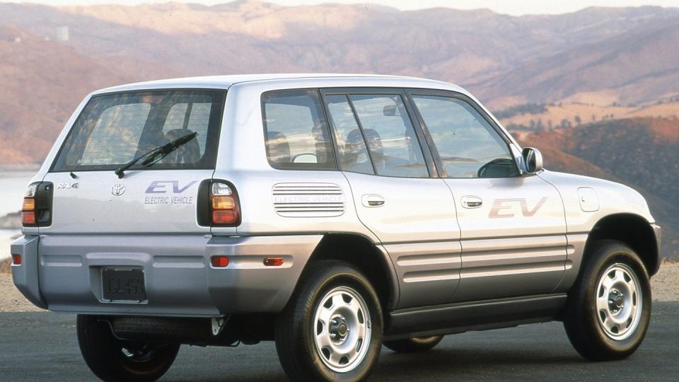 a silver suv on a road