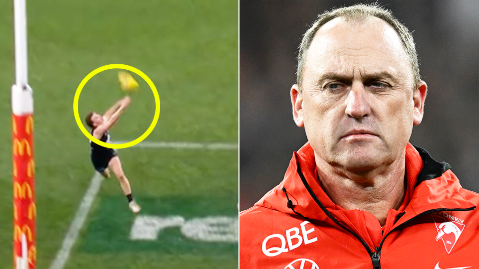 Blake Acres touches the bal land Swans coach John Longmire reacts.