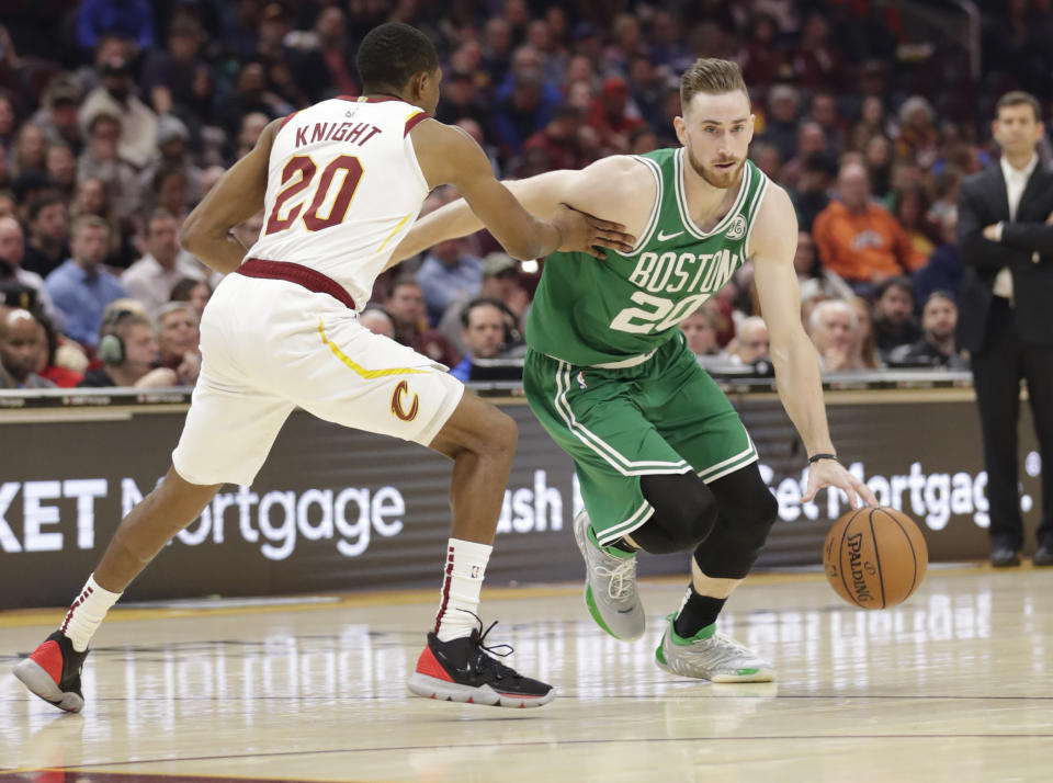 Boston Celtics' Gordon Hayward, right, drives past Cleveland Cavaliers' Brandon Knight in the first half of an NBA basketball game, Tuesday, Nov. 5, 2019, in Cleveland. (AP Photo/Tony Dejak)