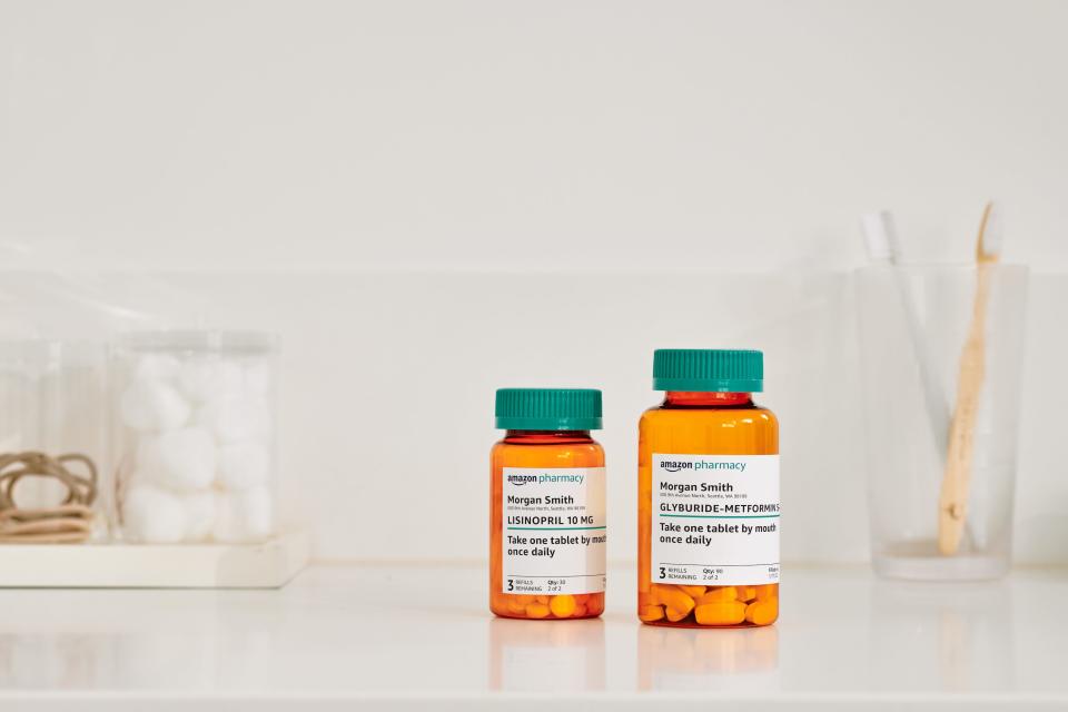 two pill bottles from Amazon pharmacy sit on a counter