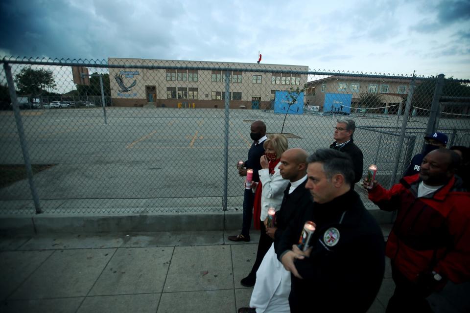 Elected officials join residents of Wilmington in a candlelight vigil