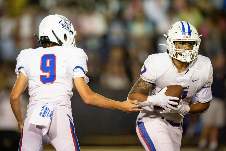 Churchill's Ceville Pasi takes the ball from Churchill's Lucas Gansen as the Marist Catholic Spartans host the Churchill Lancers Friday, Aug. 30, 2024 at Marist Catholic High School in Eugene, Ore.