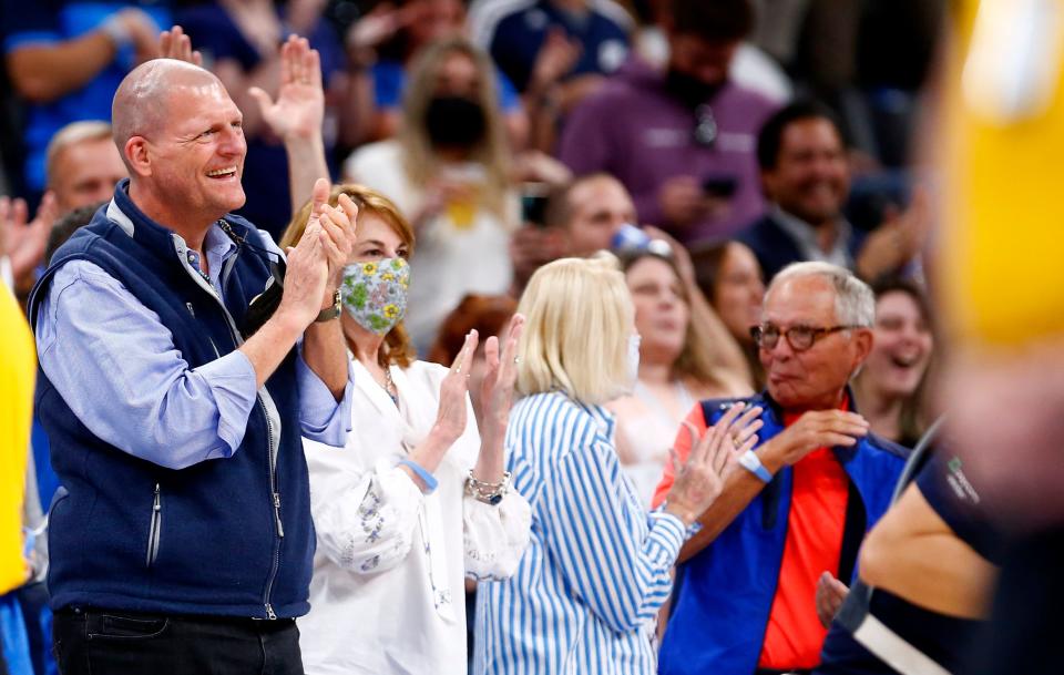 Clay Bennett cheers after a fan hit a half-court shot during the NBA basketball game between the Oklahoma City Thunder and the Philadelphia 76ers at the Paycom Center in Oklahoma City, Sunday, Oct. 24, 2021. 