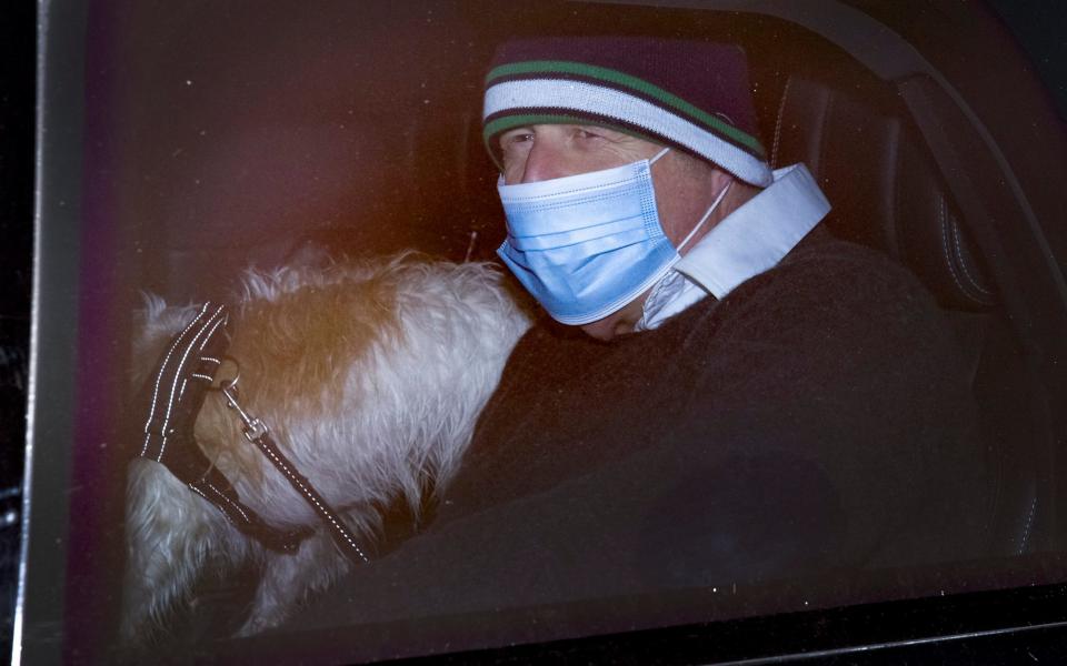 Prime Minister Boris Johnson returns to Downing Street with his dog Dilyn after his morning run - Peter Macdiarmid/LNP