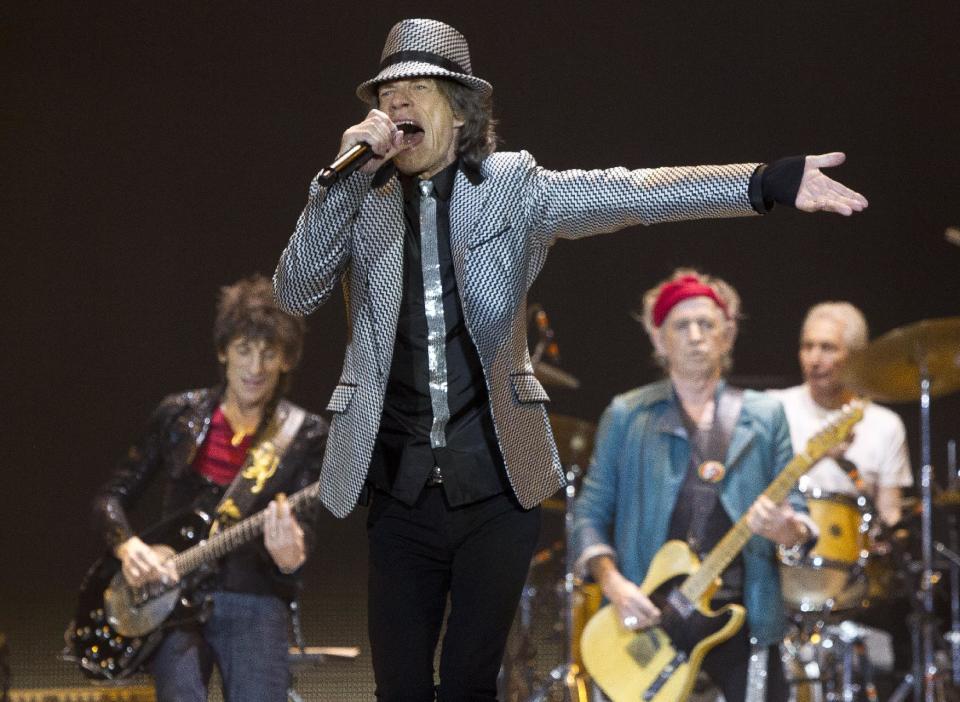 Mick Jagger, front centre, Ronnie Wood, left, with Keith Richards and Charlie Watts, right, of The Rolling Stones perform at the O2 arena in east London, Sunday, Nov. 25, 2012. The band are playing four gigs to celebrate their 50th anniversary, including two shows at London’s O2 and two more in New York. (Photo by Joel Ryan/Invision/AP)